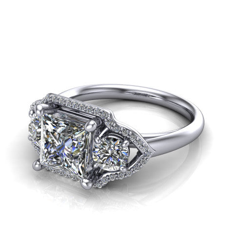 Kalani princess halo engagement ring in Platinum, three-quarter perspective showing the haloed center and two haloed round side stones linked by open scroll bridges
