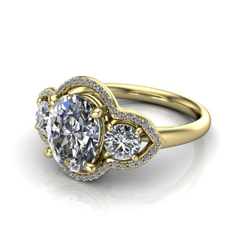 Kalani oval halo engagement ring in 14K Yellow Gold, three-quarter perspective showing the haloed center and two haloed round side stones linked by open scroll bridges