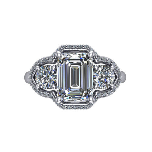 Kalani emerald halo engagement ring in Platinum, top-down view showing the haloed center diamond flanked by two haloed round side stones with filigree bridges between