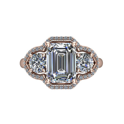 Kalani emerald halo engagement ring in 18K Rose Gold, top-down view showing the haloed center diamond flanked by two haloed round side stones with filigree bridges between