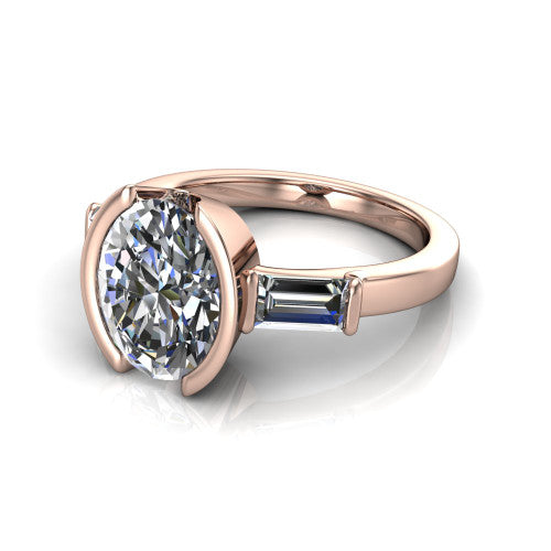 Amanda oval three stone engagement ring in 14K Rose Gold, three-quarter perspective showing the center diamond between two tapered baguette side stones on a slim polished band