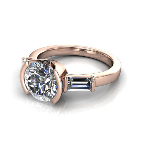 Amanda round three stone engagement ring in 18K Rose Gold, three-quarter perspective showing the center diamond between two tapered baguette side stones on a slim polished band