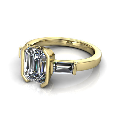 Amanda emerald three stone engagement ring in 14K Yellow Gold, three-quarter perspective showing the center diamond between two tapered baguette side stones on a slim polished band