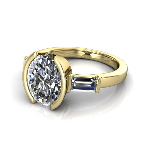 Amanda oval three stone engagement ring in 18K Yellow Gold, three-quarter perspective showing the center diamond between two tapered baguette side stones on a slim polished band