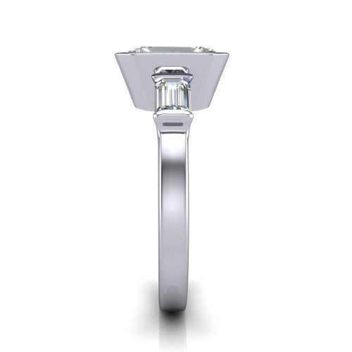 Amanda emerald three stone engagement ring in Platinum, side profile showing the tapered baguette side stone and the smooth tapered polished band