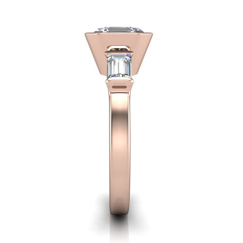Amanda asscher three stone engagement ring in 18K Rose Gold, side profile showing the tapered baguette side stone and the smooth tapered polished band