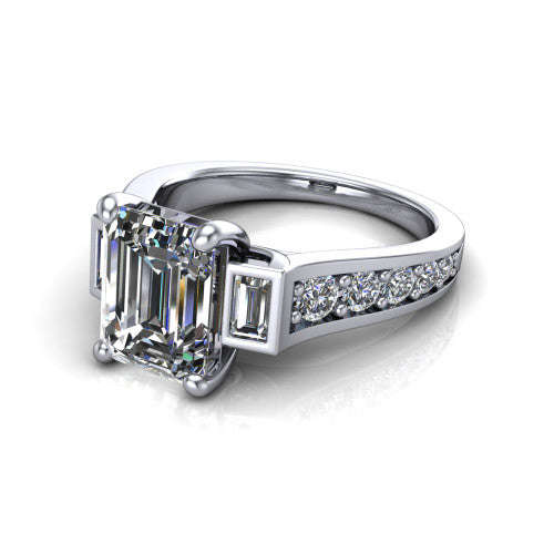 Estella emerald three stone engagement ring in 14K White Gold, three-quarter perspective showing the center diamond between two tapered baguette side stones above a pav&eacute; band