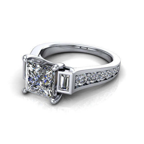 Estella princess three stone engagement ring in Platinum, three-quarter perspective showing the center diamond between two tapered baguette side stones above a pav&eacute; band