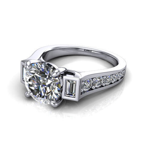 Estella round three stone engagement ring in 18K White Gold, three-quarter perspective showing the center diamond between two tapered baguette side stones above a pav&eacute; band