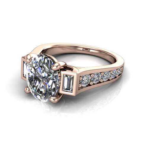Estella oval three stone engagement ring in 14K Rose Gold, three-quarter perspective showing the center diamond between two tapered baguette side stones above a pav&eacute; band
