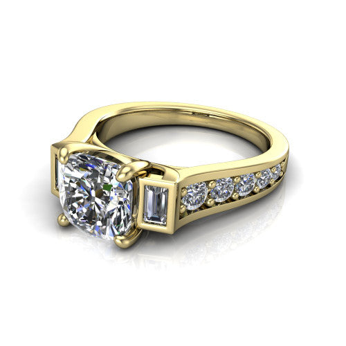 Estella cushion three stone engagement ring in 14K Yellow Gold, three-quarter perspective showing the center diamond between two tapered baguette side stones above a pav&eacute; band