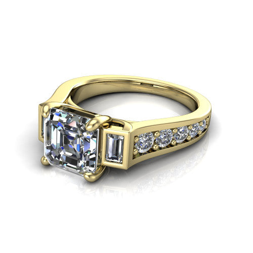 Estella asscher three stone engagement ring in 14K Yellow Gold, three-quarter perspective showing the center diamond between two tapered baguette side stones above a pav&eacute; band