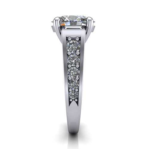 Estella oval three stone engagement ring in Platinum, side profile showing the tapered baguette side stone and the round diamonds running down the shank