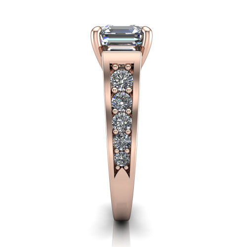 Estella asscher three stone engagement ring in 18K Rose Gold, side profile showing the tapered baguette side stone and the round diamonds running down the shank