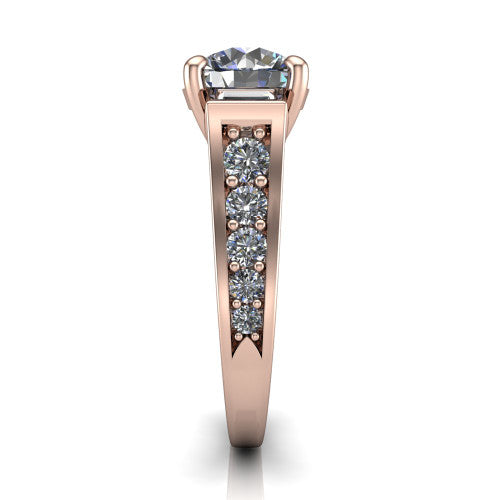 Estella round three stone engagement ring in 18K Rose Gold, side profile showing the tapered baguette side stone and the round diamonds running down the shank