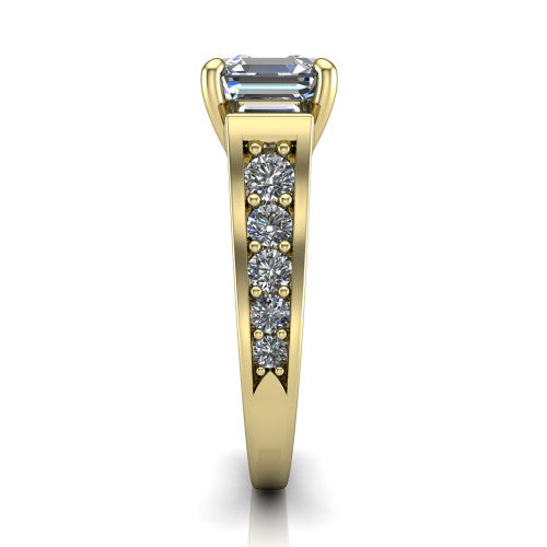 Estella asscher three stone engagement ring in 18K Yellow Gold, side profile showing the tapered baguette side stone and the round diamonds running down the shank
