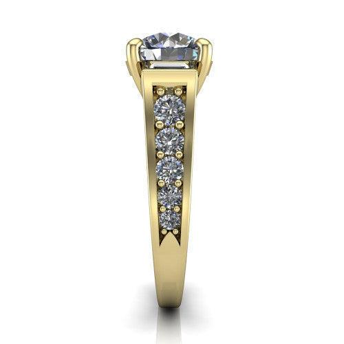 Estella round three stone engagement ring in 18K Yellow Gold, side profile showing the tapered baguette side stone and the round diamonds running down the shank