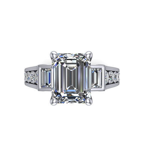 Estella emerald three stone engagement ring in 14K White Gold, top-down view showing the center diamond flanked by two tapered baguette side stones over a diamond-set shank