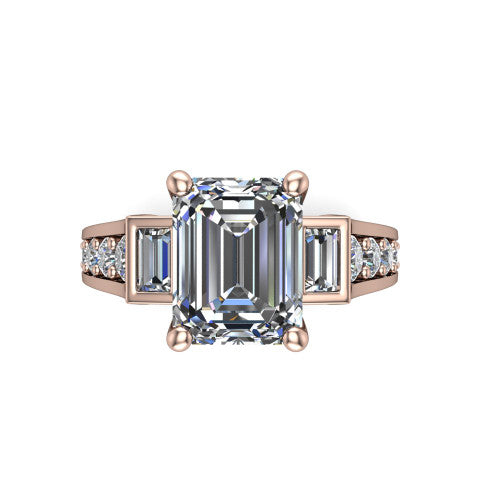 Estella emerald three stone engagement ring in 14K Rose Gold, top-down view showing the center diamond flanked by two tapered baguette side stones over a diamond-set shank