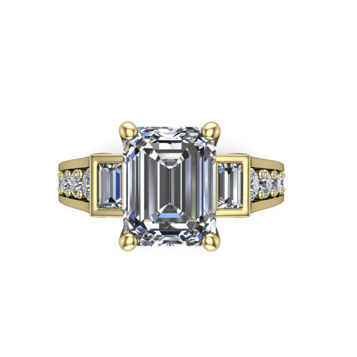 Estella emerald three stone engagement ring in 14K Yellow Gold, top-down view showing the center diamond flanked by two tapered baguette side stones over a diamond-set shank