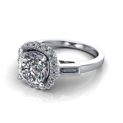 Lorelai cushion halo engagement ring in Platinum, three-quarter perspective showing the haloed center between two tapered baguette side stones on a slim polished band
