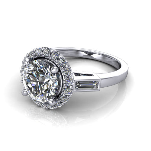 Lorelai round halo engagement ring in Platinum, three-quarter perspective showing the haloed center between two tapered baguette side stones on a slim polished band