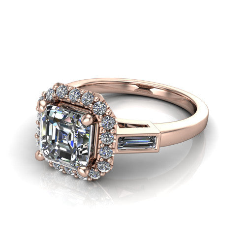 Lorelai asscher halo engagement ring in 14K Rose Gold, three-quarter perspective showing the haloed center between two tapered baguette side stones on a slim polished band