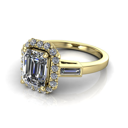 Lorelai emerald halo engagement ring in 18K Yellow Gold, three-quarter perspective showing the haloed center between two tapered baguette side stones on a slim polished band