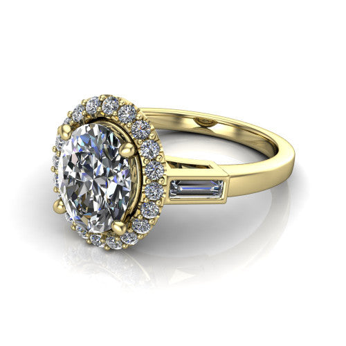 Lorelai oval halo engagement ring in 14K Yellow Gold, three-quarter perspective showing the haloed center between two tapered baguette side stones on a slim polished band
