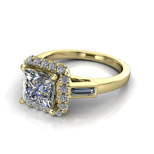 Lorelai princess halo engagement ring in 14K Yellow Gold, three-quarter perspective showing the haloed center between two tapered baguette side stones on a slim polished band