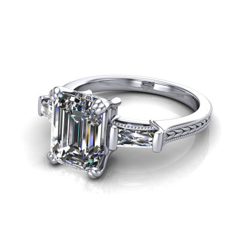 Camille emerald three stone engagement ring in 18K White Gold, three-quarter perspective showing the center diamond between two tapered baguette side stones above a hand-engraved band