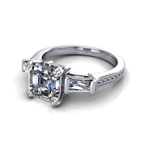 Camille asscher three stone engagement ring in 14K White Gold, three-quarter perspective showing the center diamond between two tapered baguette side stones above a hand-engraved band