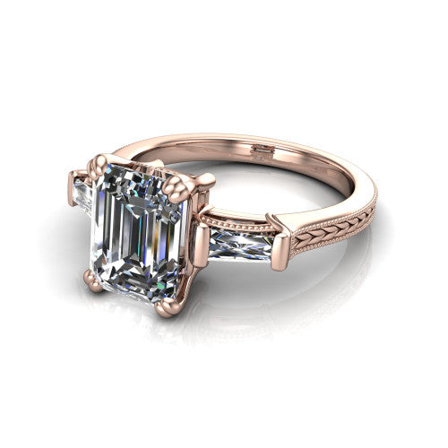 Camille emerald three stone engagement ring in 14K Rose Gold, three-quarter perspective showing the center diamond between two tapered baguette side stones above a hand-engraved band