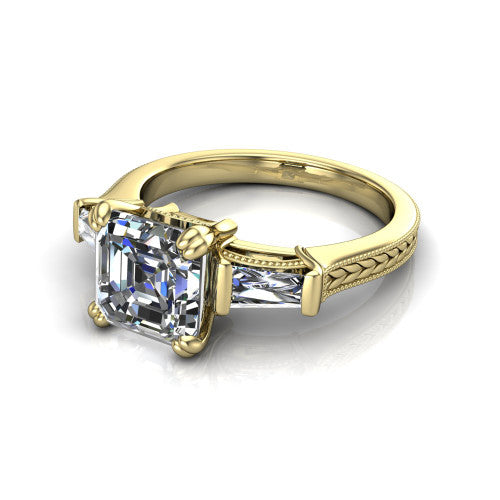 Camille asscher three stone engagement ring in 18K Yellow Gold, three-quarter perspective showing the center diamond between two tapered baguette side stones above a hand-engraved band