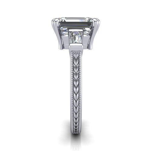 Camille emerald three stone engagement ring in 14K White Gold, side profile showing the tapered baguette side stone and the hand-engraved wheat pattern down the band