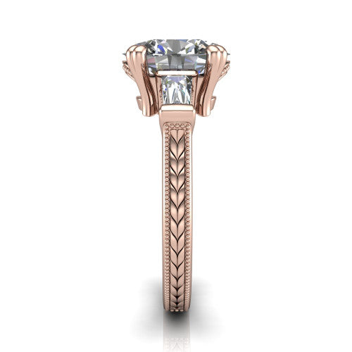 Camille oval three stone engagement ring in 14K Rose Gold, side profile showing the tapered baguette side stone and the hand-engraved wheat pattern down the band
