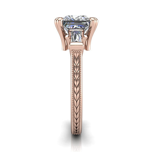 Camille princess three stone engagement ring in 14K Rose Gold, side profile showing the tapered baguette side stone and the hand-engraved wheat pattern down the band