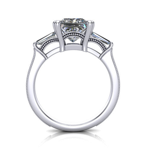 Camille princess three stone engagement ring in Platinum, through-finger front profile showing the three-stone head raised above the engraved milgrain shank