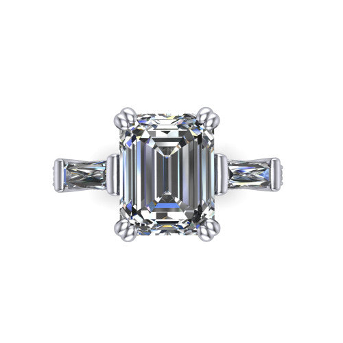 Camille emerald three stone engagement ring in Platinum, top-down view showing the center diamond flanked by two tapered baguette side stones in a three stone setting