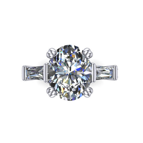 Camille oval three stone engagement ring in Platinum, top-down view showing the center diamond flanked by two tapered baguette side stones in a three stone setting
