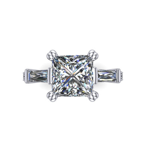 Camille princess three stone engagement ring in 18K White Gold, top-down view showing the center diamond flanked by two tapered baguette side stones in a three stone setting