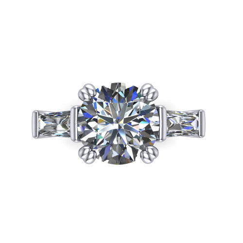 Camille round three stone engagement ring in 14K White Gold, top-down view showing the center diamond flanked by two tapered baguette side stones in a three stone setting