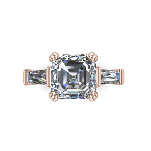 Camille asscher three stone engagement ring in 14K Rose Gold, top-down view showing the center diamond flanked by two tapered baguette side stones in a three stone setting