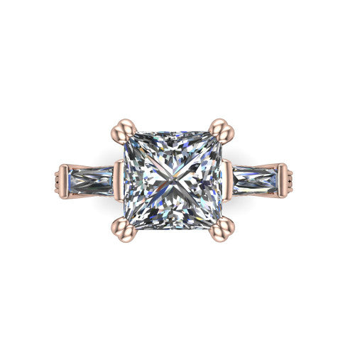 Camille princess three stone engagement ring in 14K Rose Gold, top-down view showing the center diamond flanked by two tapered baguette side stones in a three stone setting