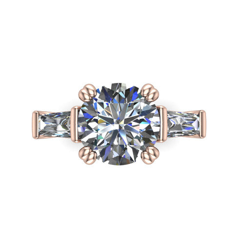 Camille round three stone engagement ring in 18K Rose Gold, top-down view showing the center diamond flanked by two tapered baguette side stones in a three stone setting