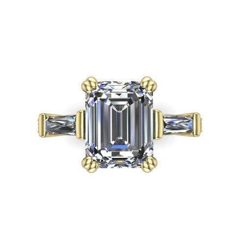 Camille emerald three stone engagement ring in 14K Yellow Gold, top-down view showing the center diamond flanked by two tapered baguette side stones in a three stone setting