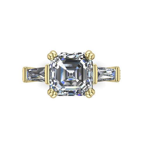 Camille asscher three stone engagement ring in 14K Yellow Gold, top-down view showing the center diamond flanked by two tapered baguette side stones in a three stone setting