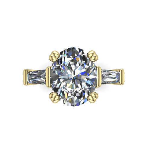 Camille oval three stone engagement ring in 14K Yellow Gold, top-down view showing the center diamond flanked by two tapered baguette side stones in a three stone setting