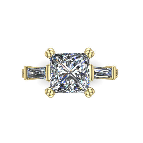 Camille princess three stone engagement ring in 14K Yellow Gold, top-down view showing the center diamond flanked by two tapered baguette side stones in a three stone setting