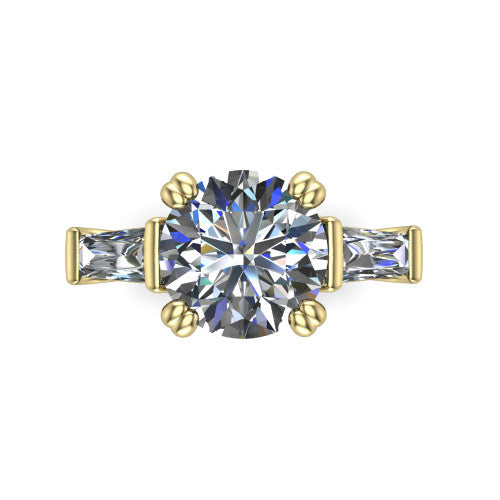 Camille round three stone engagement ring in 14K Yellow Gold, top-down view showing the center diamond flanked by two tapered baguette side stones in a three stone setting